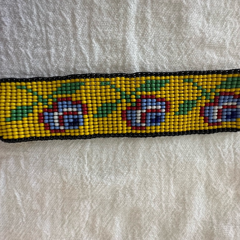 Handmade. 
Yellow and Black Beaded Belt Accessory